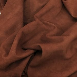 goat suede sL-1002 Rustic Brown Goatskin Garment Suede Leather 5-7 square feet hide Leather 1.5oz thick soft and easy to use Suitable for shoes footwear handbags garments shirts jackets vests What is Goat Suede? Goat suede undergoes an extra finishing process that creates a velvety texture. This process involves buffing the flesh side of the hide, resulting in a soft and textured nap that feels wonderful to the touch.