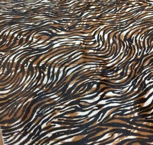 Avetco Inc-Cow Hair On Zebra Print Black with Brown 2 Small Cowhide with striking black and brown zebra print. Ideal for handbags, shoes, garments, upholstery, pillows, and décor. Natural, bold, and stylish finish.