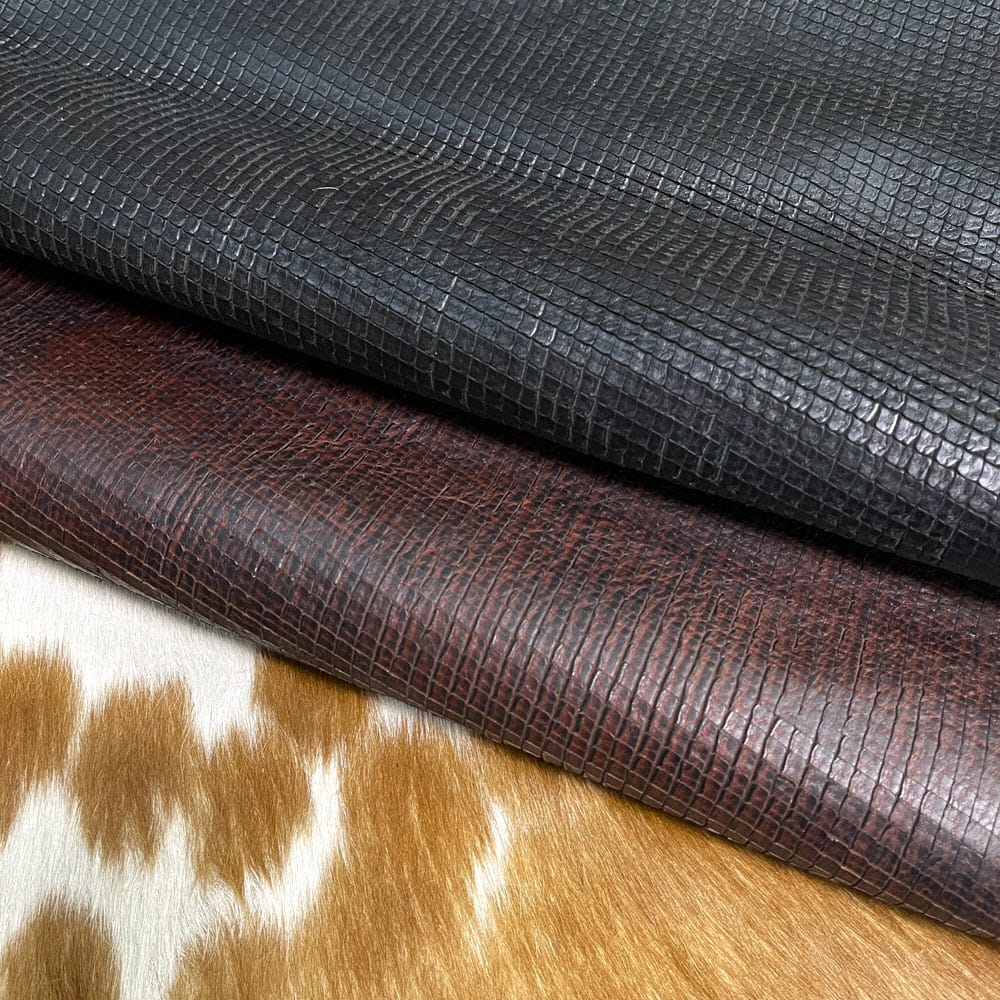 Alexa-Avetcoinc Introducing Alexa Veg Tanned Cow Leather - a special type of leather that is crafted from full grain hide and treated with vegetal tanning. This unique leather boasts a reptile scale-like appearance, but with a more polished and refined look. An aniline finish gives it a waxy, matte texture, while deep grooves outline each square, highlighting their appearance. The squares are also creased, adding texture and definition. The Alexa collection is perfect for various leather needs due to its subtle shine and remarkable design. This leather is made from heifer (double shoulder) and weighs 5/6 oz. (2.2 mm-2.4 mm). It is 100% veg-tanned and dyed through (drum dye). The leather is classified as full-grain with a medium pull-up, has a semi-soft temper, and is sourced from Mexico. The Alexa leather is perfect for crafting straps, handbags, accessories, footwear, belts, and leather crafts.