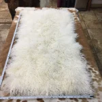 Our Mongolian Tibetan lamb fur plates, handpicked by expert craftsmen, offer superior quality. Each skin is made of the finest silky, long, and ultra-soft wool, ensuring it meets your standards. These plates are perfect for adding a touch of luxury to your home decor. You can use them to upholster furniture such as sofas, chairs, ottomans, benches, etc. They are also widely used in the fashion industry to create scarves, boas, tote bags, garments, and accessories. These 2ft x 4ft plates made with 4-5 inch long curly soft wool offer both style and comfort, making them an excellent choice for home decor or fashion.