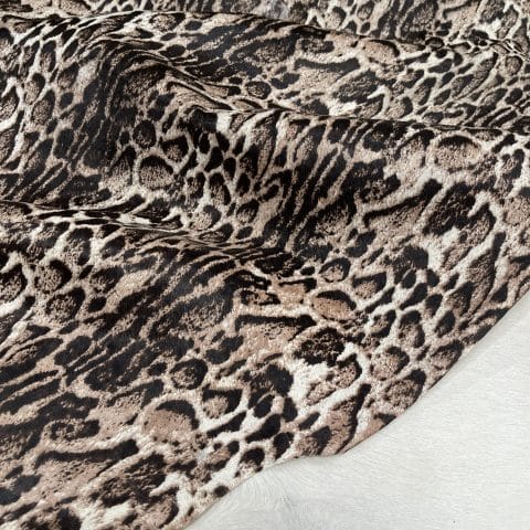 This beige cowhide with panther print adds a fierce, fashion-forward edge to any design. With bold black markings over soft beige tones, it's ideal for handbags, shoes, garments, furniture, pillows, and interior décor. Printed on premium hair-on cowhide and chrome tanned for durability and softness. Each hide is unique, perfect for custom statement pieces.