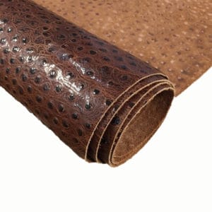 Rustic Brown Alba Ostrich Embossed Cow Leather is made of European leather with a unique embossed grain texture that resembles Ostrich skin. Its rough appearance, complete with grooves and bumps, makes it beautiful and durable. The leather has a waxed finish that adds smoothness and shine to its surface. This collection uses chrome tanning, which gives it a luxurious and rich look.