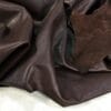 Brown Buffalo Analine avetco leather (11) Buffalo Leather is a type of full-grain leather that has a rich and natural texture. The leather is soft to the touch and offers excellent comfort. It is also durable and has a consistent color, making it an exquisite option for upholstery, accessories, handbags, shoes, motorcycle apparel, and more. The unbuffed surface gives the material a matte appearance with a subtle shine, adding character to its otherwise subtle look. The Buffalo aniline collection is also skillfully prepared to provide excellent cutting yields.