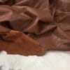 Cognac Buffalo Analine avetco leather (7) Buffalo Leather is a type of full-grain leather that has a rich and natural texture. The leather is soft to the touch and offers excellent comfort. It is also durable and has a consistent color, making it an exquisite option for upholstery, accessories, handbags, shoes, motorcycle apparel, and more. The unbuffed surface gives the material a matte appearance with a subtle shine, adding character to its otherwise subtle look. The Buffalo aniline collection is also skillfully prepared to provide excellent cutting yields.