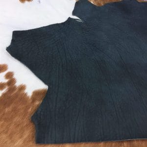 Premium quality black veg-tanned tooling and stamping leather is an excellent choice for your projects, as it undergoes a 100% vegetable tanning process through a drum process. All selections go through the same process, which guarantees quality in rupture, moisture, water penetration, and flexibility. This leather is ideal for use in crafting straps, belts, cinches, pet collars and leashes, footwear, holsters and sheaths, and strops. It is made from cowhide (double shoulder) and is 8-9 oz. thick (3.2 - 3.6 mm). The color is charcoal black (struck-through), and the average hide size is 14-17 sq. ft. The texture is smooth, and the temper is stiff. It is 100% veg-tanned and comes from Mexico.