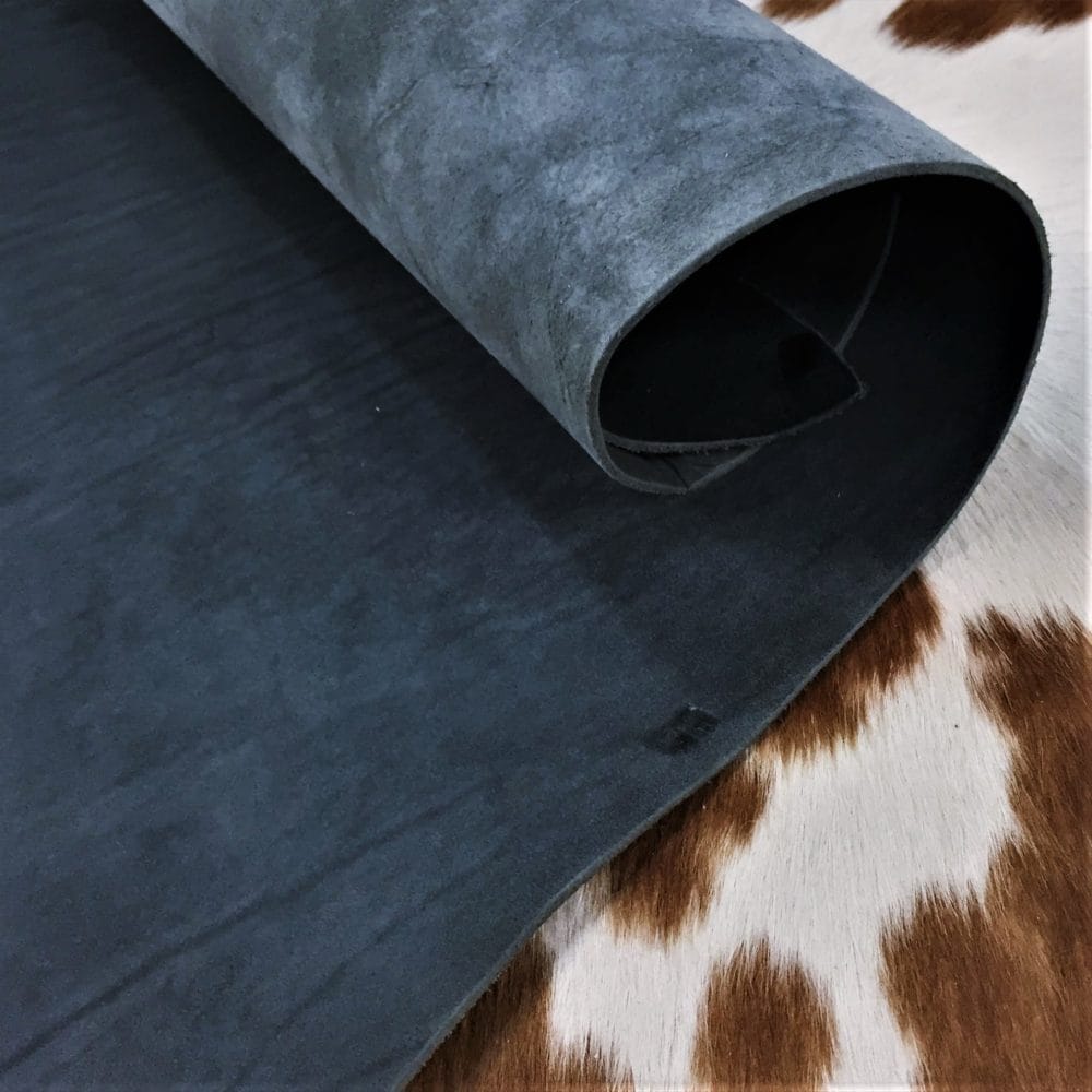 8-9 OZ BLACK VEG avetcoinc (5) Premium quality black veg-tanned tooling and stamping leather is an excellent choice for your projects, as it undergoes a 100% vegetable tanning process through a drum process. All selections go through the same process, which guarantees quality in rupture, moisture, water penetration, and flexibility. This leather is ideal for use in crafting straps, belts, cinches, pet collars and leashes, footwear, holsters and sheaths, and strops. It is made from cowhide (double shoulder) and is 8-9 oz. thick (3.2 - 3.6 mm). The color is charcoal black (struck-through), and the average hide size is 14-17 sq. ft. The texture is smooth, and the temper is stiff. It is 100% veg-tanned and comes from Mexico.