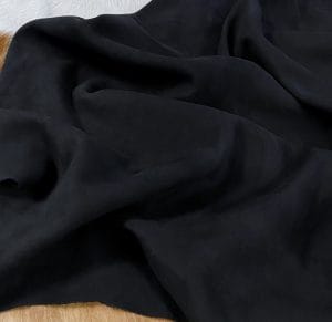 black nubuck lamb leather avetcoinc@ The Nubuck Lambskin Collection is a type of leather that feels soft and luxurious, with a trendy and eye-catching appearance. The leather undergoes a unique tanning process that involves lightly buffing the grain surface, resulting in a very soft and pleasing texture. This leather is suitable for various applications, including apparel, moccasins, toy and doll clothing, lining, handbags, shoes, and accessories. The leather comes in full hide specification, with an average size of 6-8 square feet. It is made from lamb skin and has a nubuck finish. The leather thickness is 2 oz (0.7-0.9mm)