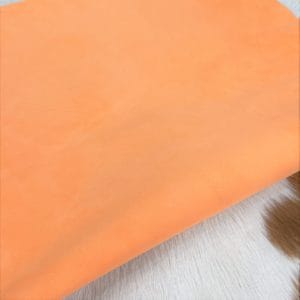 Tangerine goat suede leather hide