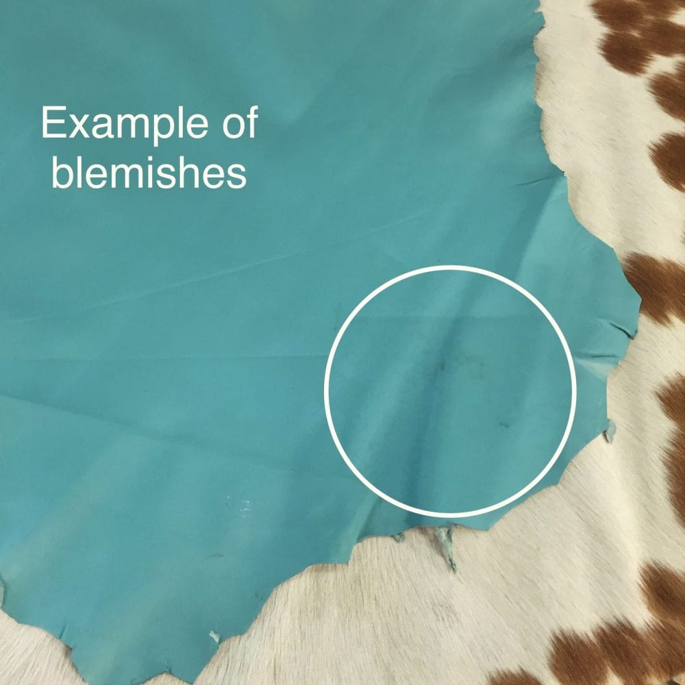 Avetco Inc Economy Lambskin Turquoise (3) Lambskin Leather Grade C is a type of leather that might have some imperfections, but they do not affect its performance. Instead, these flaws give it a unique appearance. The leather's raw material is sourced from sheep or lamb, and it weighs 2 oz. with a thickness of 0.7-0.9 mm. Furthermore, the economy grade Lamb leather may have uneven shade tone, dark spots, stretch marks, scarring, scratches, or a few holes. However, these flaws do not affect its performance. Instead, they give it a unique appearance that sets it apart from other types of leather.