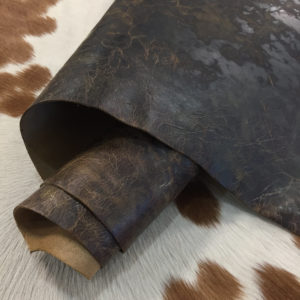 Iguana Pine Cone Distressed cowhide with a rugged, vintage look and waxy feel—perfect for bold footwear, bags, belts, and standout DIY leather projects.