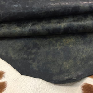 Iguana Black Distressed cowhide with a rugged, vintage look and waxy feel—perfect for bold footwear, bags, belts, and standout DIY leather projects.