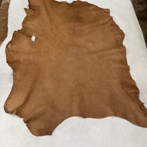 SL-103TAN Florence is full-grain lambskin leather with an aniline finish, showcasing natural blemishes and rich character through transparent dyes for a raw, authentic look.