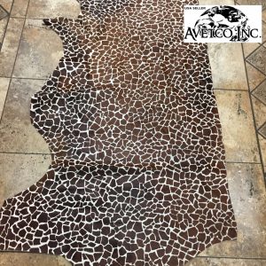 Cow Hair On Giraffe-Chestnut This chestnut cowhide features a bold giraffe print, offering a unique, exotic touch to any project. Perfect for handbags, upholstery, footwear, garments, pillows, and décor. Printed on premium hair-on cowhide for durability and natural texture with a wild, stylish edge. Each hide is one-of-a-kind—ideal for standout fashion and interior designs.