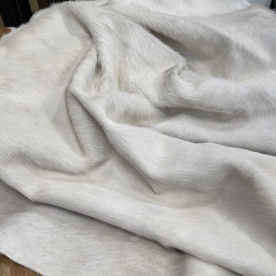 CHO-White-Cow-Hair-On-Avetco-Inc-1.JPG Natural white cowhide with hair-on finish. Perfect for upholstery, décor, handbags, and fashion. Chrome tanned, soft, and durable with a clean, elegant look.