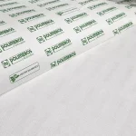 Oropal E162SP is a type of self-adhesive interfacing fabric that provides stability and strength to fabrics of various weights, from lightweight to medium weight. This non-woven interfacing is a crucial material in adding intricate details to any sewing project, such as interlining, shoes, handbags, garments, and leather. The interfacing is made of high-quality polyester, which is a synthetic material known for its durability and strength. It is available in two classic colors, white and black, making it easy to match with any type of fabric. The fabric is 57 inches wide, with a tolerance of plus or minus 2 inches, and each roll contains 5 yards with a thickness of 0.5mm. The texture of the interfacing is medium, which means it is not too rough or too smooth. This texture provides stability without causing any discomfort or irritation. It is also flexible and easy to work with, making it ideal for a wide range of sewing projects.