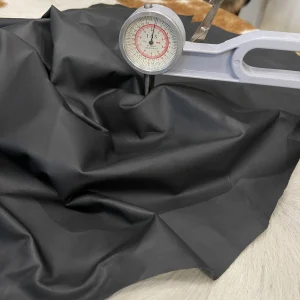 SL-100BLK Lambskin Leather Avetcoinc 3 This high-quality lambskin garment leather is made from 100% British lambskin, renowned for its soft and supple texture. The leather is expertly tanned using the chrome tanning process, which results in a durable and long-lasting product that will wear beautifully over time. The leather is available in a full hide size of 5-7 sq. ft. and has a full-grain finish, which means that it retains the natural texture and markings of the original hide. The thickness of the leather is 1 oz, which equates to a range of 0.4-0.6 mm. The leather is sourced from Turkey, where it undergoes rigorous quality control procedures to ensure that it meets the highest standards. The resulting product is a premium-grade leather that is perfect for creating luxurious garments and accessories that will stand the test of time.
