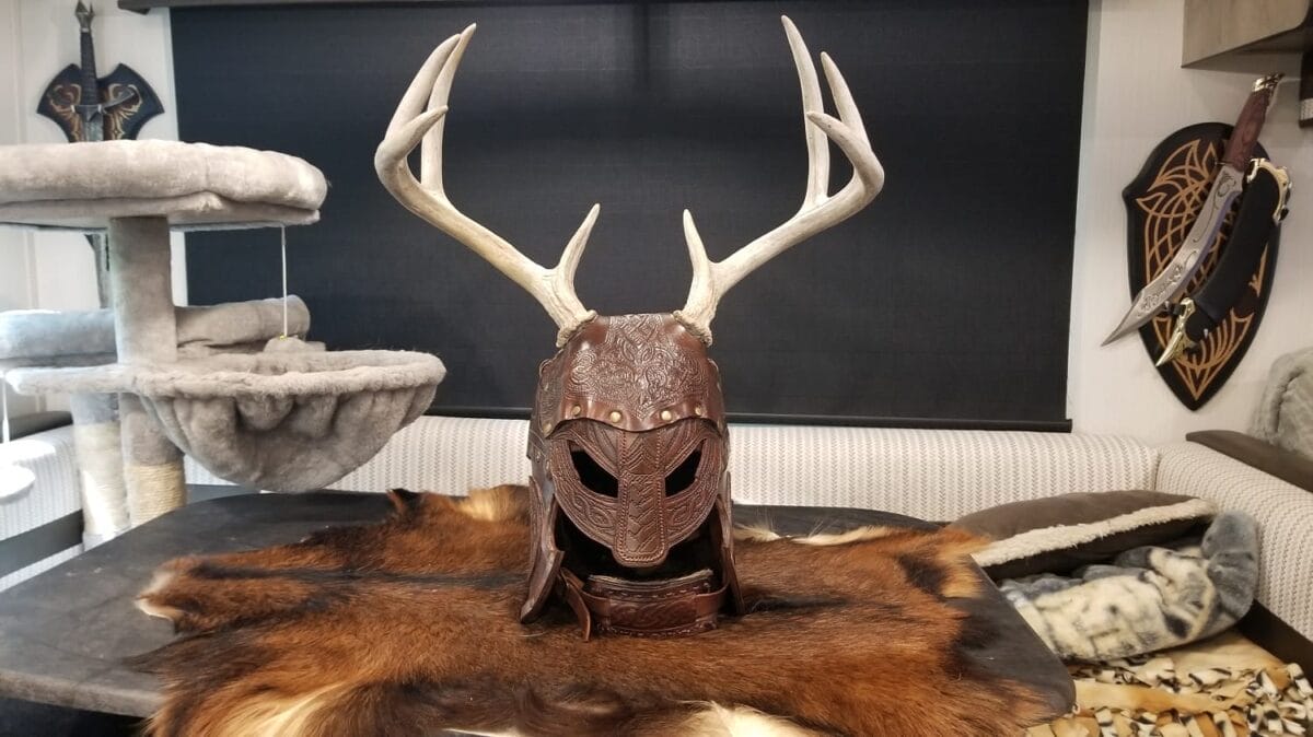 Helm on the stand made with Avetco materials by Roosters Leather & Steel