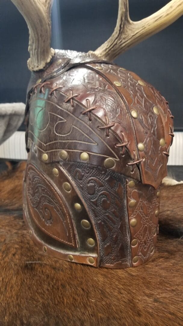 Carved helm detail made with Avetco materials by Roosters Leather & Steel