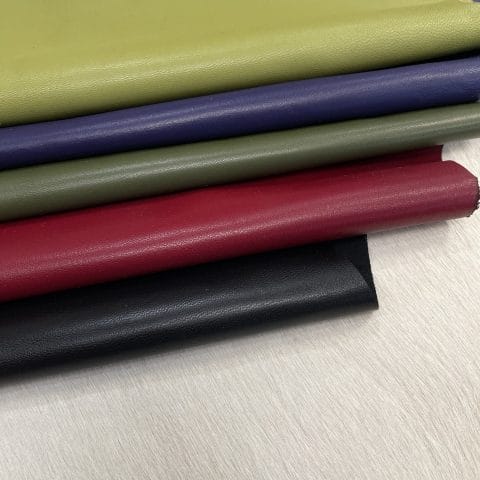 Heritage Goatskin Leather features a silky smooth texture and a refined finish. Available in rich shades of red, black, green, and purple, it offers durability and versatility for bold, sophisticated designs.