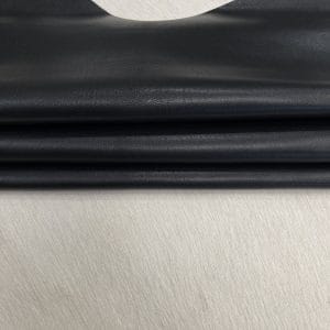 SL-200BLK Black Heritage Goatskin Leather features a silky smooth texture and a refined finish. Available in rich shades of red, black, green, and purple, it offers durability and versatility for bold, sophisticated designs.