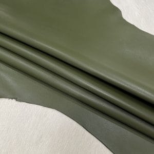 SL-200CYG Cyress Green 1 Heritage Goatskin Leather features a silky smooth texture and a refined finish. Available in rich shades of red, black, green, and purple, it offers durability and versatility for bold, sophisticated designs.