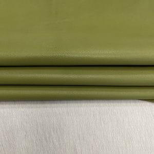 SL-200GRO Green Olive Heritage Goatskin Leather features a silky smooth texture and a refined finish. Available in rich shades of red, black, green, and purple, it offers durability and versatility for bold, sophisticated designs.