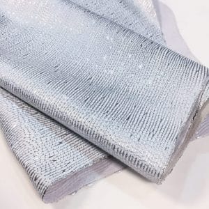 Close-up of punto Metallic Nubuck Cow Leather in White with Silver Foil