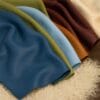 Cobalt Side Hides-Avetco Assorted colors of Cobalt full grain cowhide side leather with pebbled texture, displayed on shearling surface
