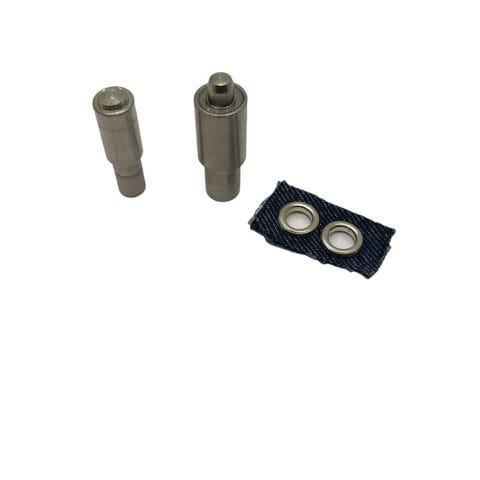 Two matching steel die setters for 7.8mm EL2 beveled grommets displayed on a white background, shown with a denim swatch featuring installed grommets.
