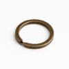 Antique brass split key ring on a white background.-Avetco