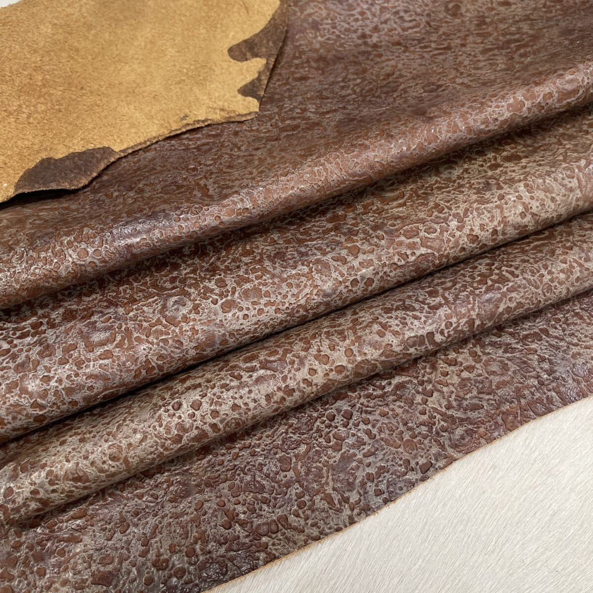 Rusted Terrain embossed cow leather, tan side hide, 2/3 oz Stone Age Collection