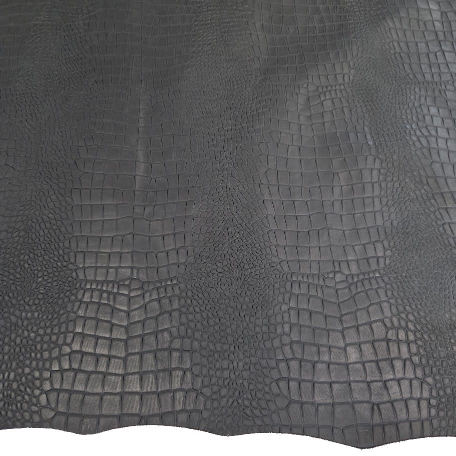 black olive escape alligo cow leather crocco belly embossed close up Close-up of dark gray crocodile-embossed leather with irregular scale pattern for a textured material image, macro shot.