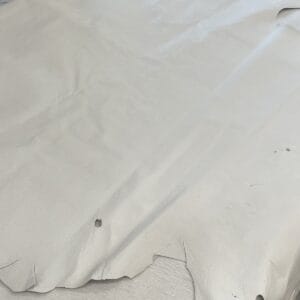 Bone pig leather hide showing natural scratches, marks and a small hole Bone Pig Full Grain Leather 1.5 oz – Half Bundle approx. 200 Sq. Ft. – Tannery Run