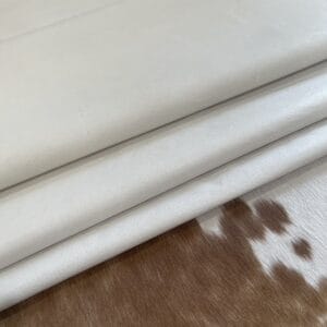 Bone pig leather hides folded in layers Bone Pig Full Grain Leather 1.5 oz – Half Bundle approx. 200 Sq. Ft. – Tannery Run
