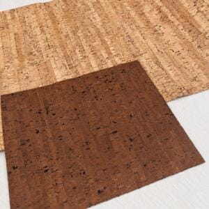 Two overlapping cork veneer swatches, light and dark brown, on a white background.