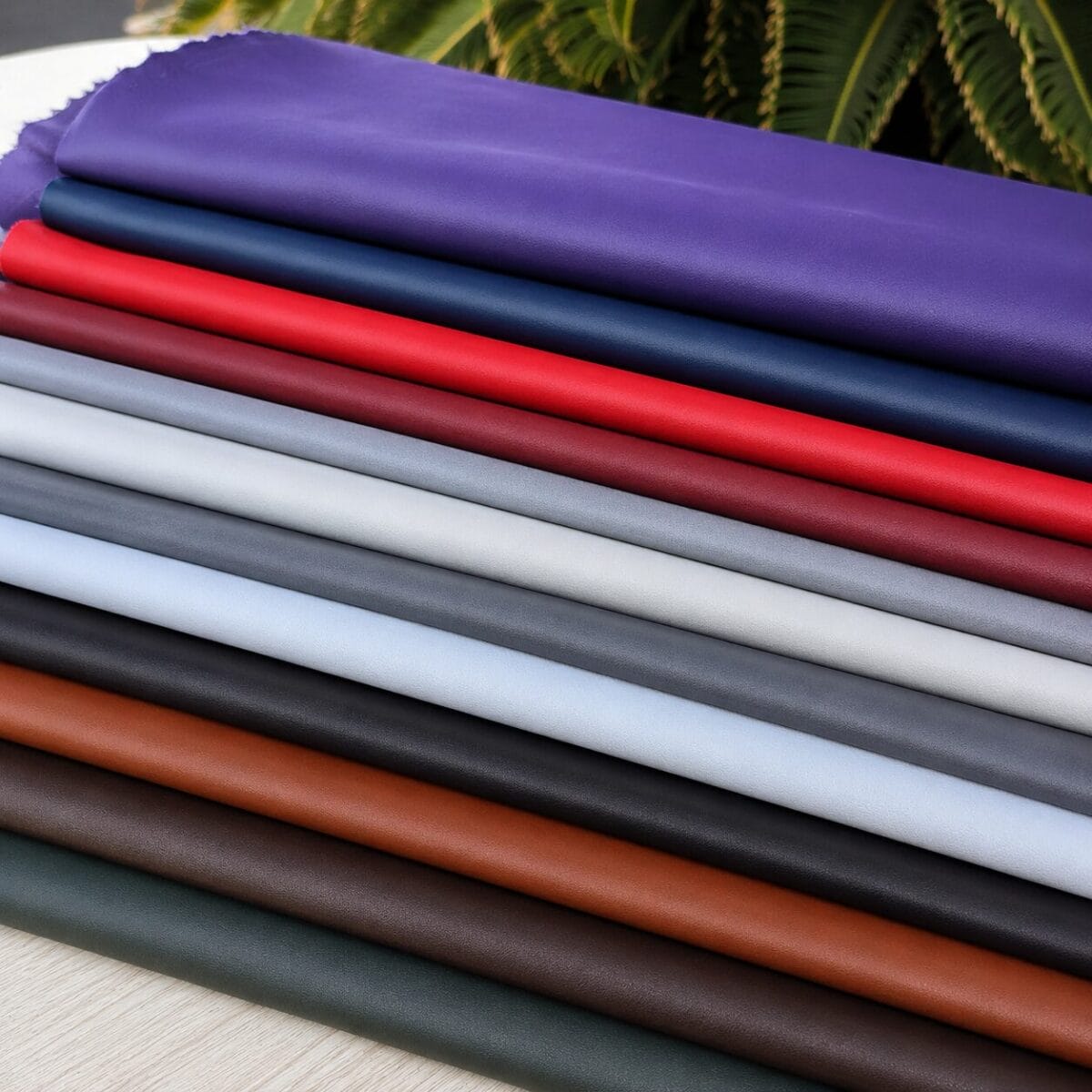 SL-115 Stretch Lamb SL-115 Stretch Lamb leather hides displayed in multiple colors including purple, navy blue, red, gray, black, brown, white, and green.