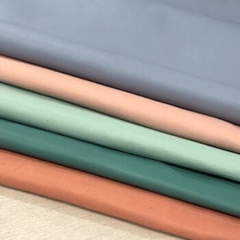 Craft grade leather half hides stacked in pastel colors