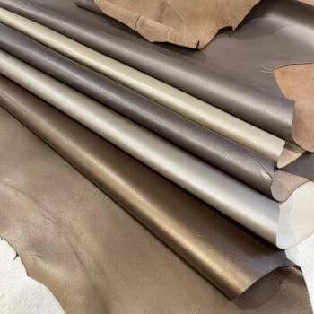 Pearlized goatskin leather 3 oz hides rolled in bronze, pewter, taupe and platinum shades