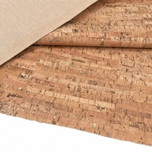 Roll of natural cork fabric with a beige backing, partially unrolled on a white surface.