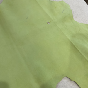 Lettuce Green goat suede hide with a small hole and pen marks