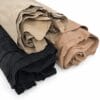 _main Rolled bundles of suede-like leather scraps in black, beige, and tan laid together on a white background.