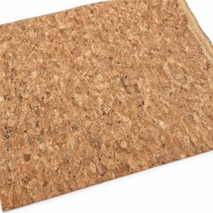 natural cork fabric seville Close-up of a corkboard surface showing the granular cork texture in warm brown tones.