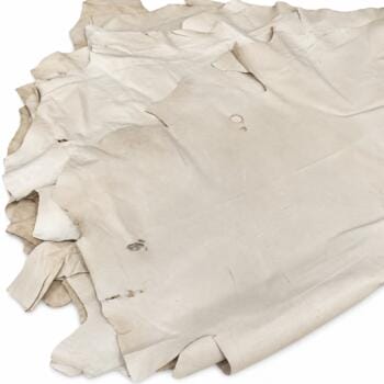 Natural pig leather hides stacked – tannery run half bundle