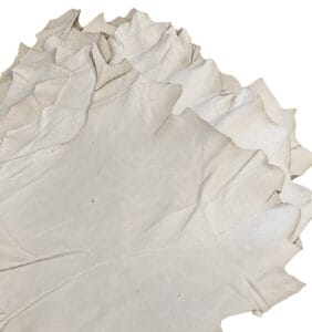 Natural full grain pig leather surface with folds and natural grain marks Natural full grain pig leather surface with folds and natural grain marks – tannery run