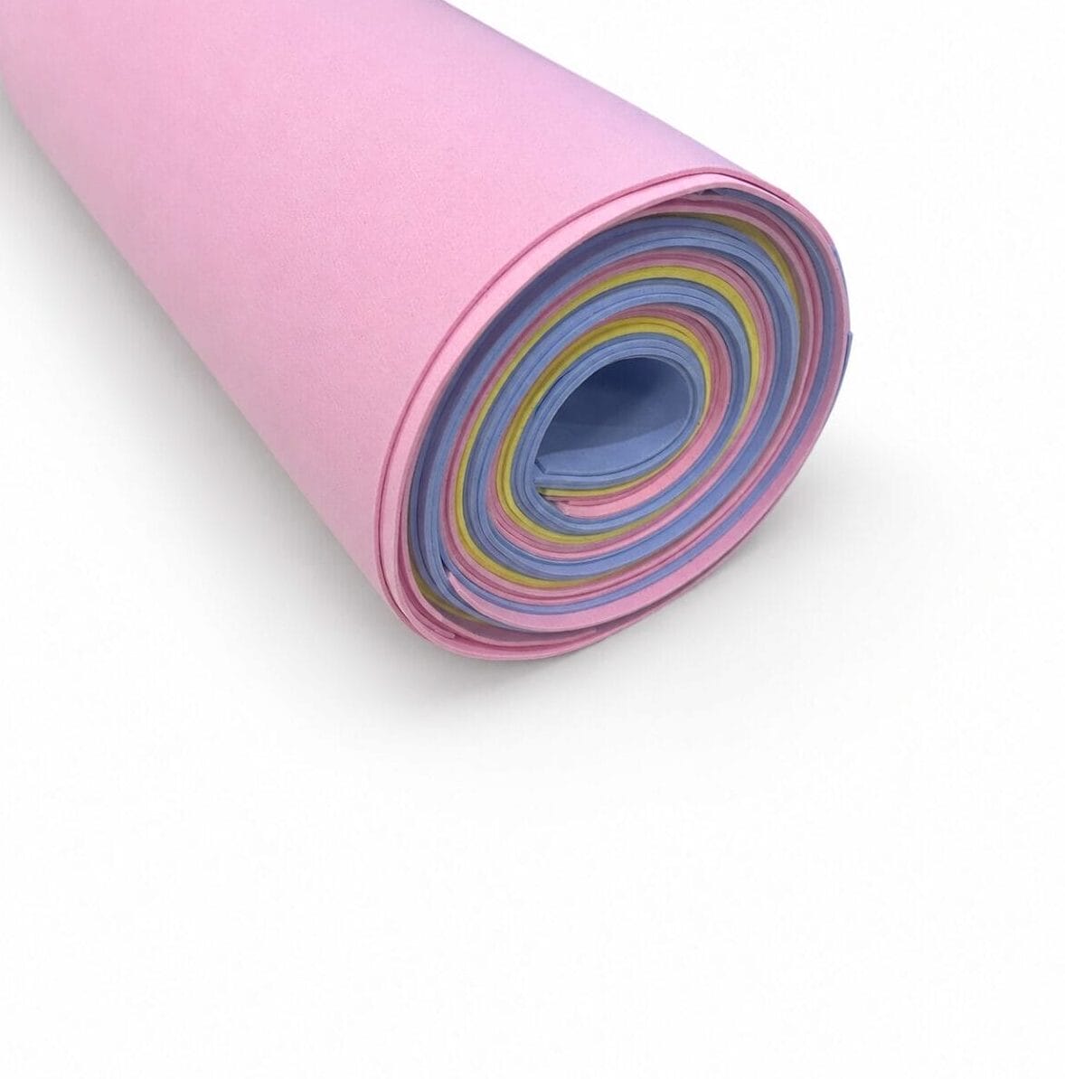 pastel candy mix colors Rolled pink craft foam sheet with concentric rainbow layers visible inside (blue, yellow, pink).