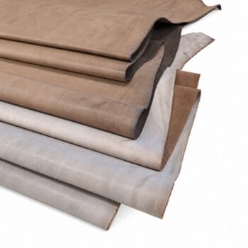 Stack of Pegasus waxed cow leather sides in Brown and Coffee Bean