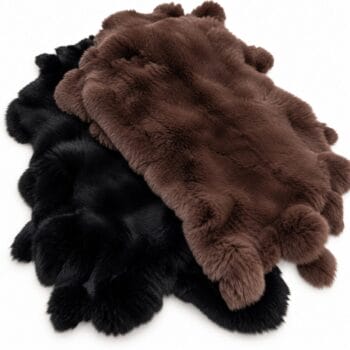 Two plush faux-fur rugs in black and brown overlapping on a white background.