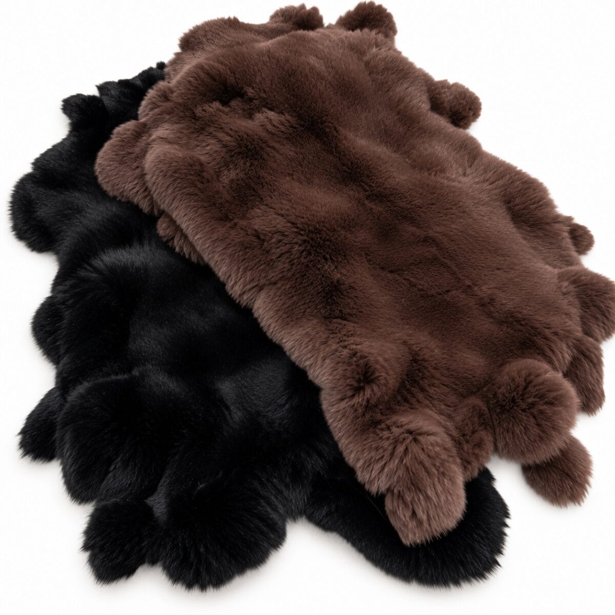 rex rabbit black and brown Two plush faux-fur rugs in black and brown overlapping on a white background.