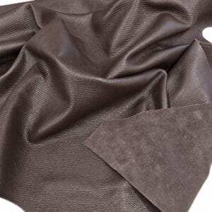 Sierra crosshatch embossed cow leather in brown, draped to show the saffiano-style texture