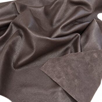 Sierra crosshatch embossed cow leather in brown, draped to show the saffiano-style texture